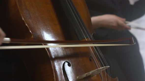 Woman in a Black Sweater Plays the Cello