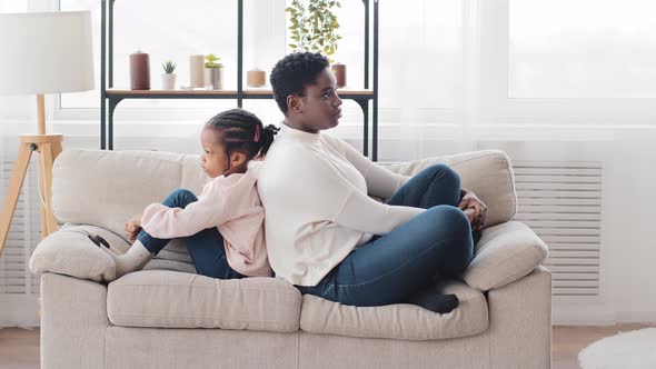 Offended Afro American Mother and African Daughter Turned Away After Family Quarrel Sitting with