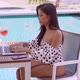 Happy Ethnic Young Woman Using Laptop Near Swimming Pool - VideoHive Item for Sale