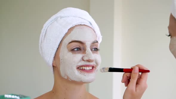 Beautiful Woman Having a Facial Treatment at Spa