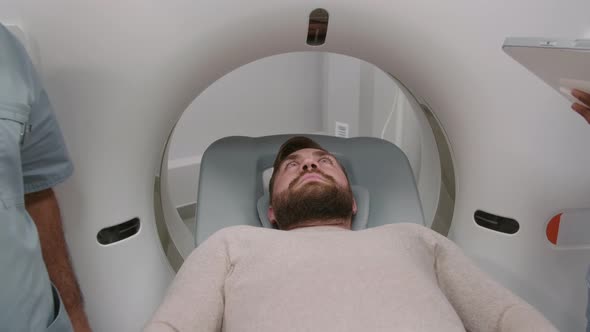 Man Undergoing CT Scan Procedure