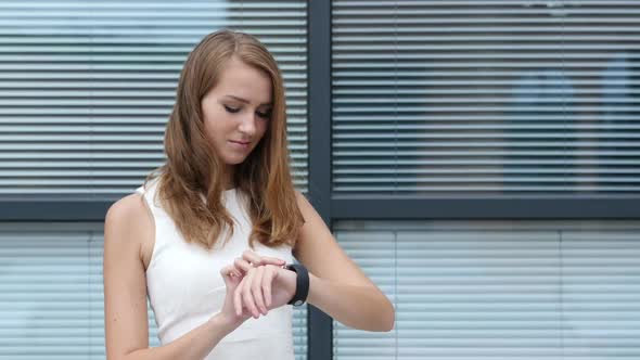 Using Smartwatch by Beautiful Girl, Outside Office