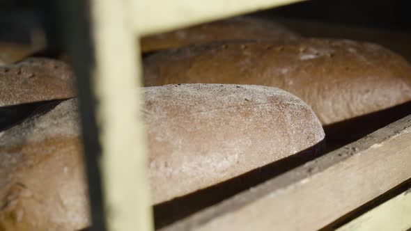 Close View of Stack with Freshly Baked Loaves of Bread with Bran for Commerce