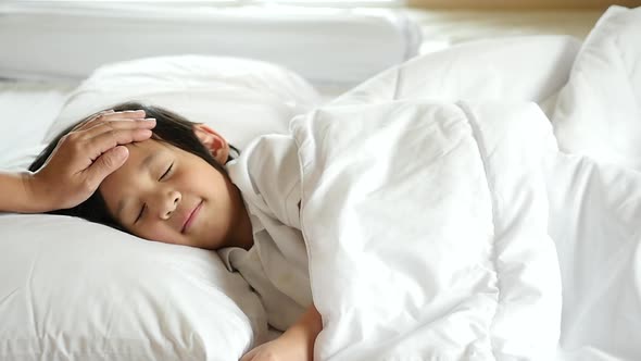 Cute Asian Child Sleeping On White Bed With Mother Care Slow Motion