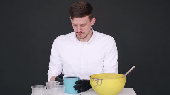 Man in White Uniform Making Pot in Creative Studio