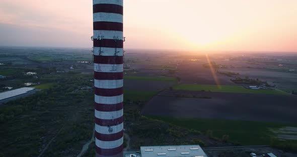 Aerial view, drone flight upwards the idle chimney.