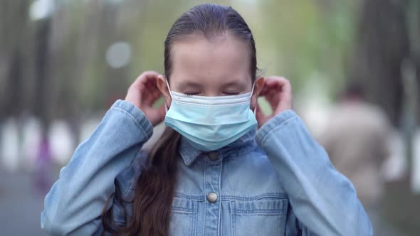 Pandemic Portrait of Girl Wearing Protective Mask in Urban