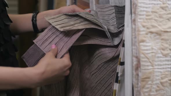 Female Client in Interior Design Studio Looking at Fabric Samples