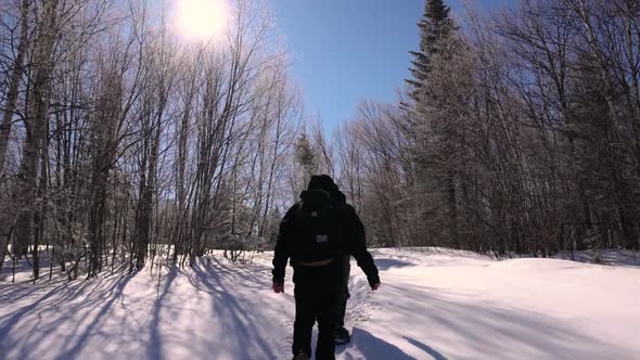 Documentary Makers Walking Through Fresh Snow