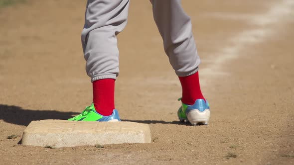 Kids playing little league baseball.