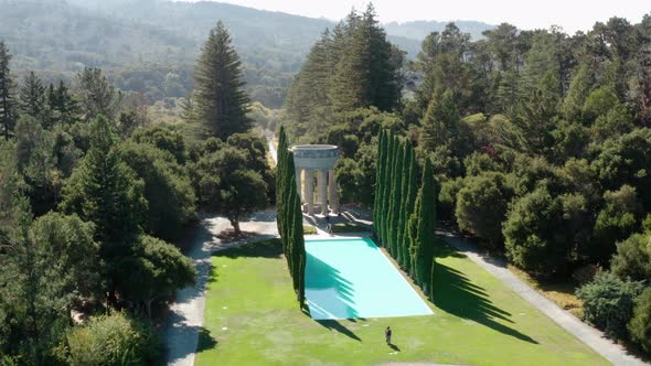 Aerial: Las Pulgas Water Temple, Trees and Fountain. Descending