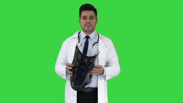 Doctor Telling X Rays Results To Camera on a Green Screen, Chroma Key