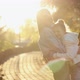 Mother and Daughter Hugging While Walking in the Park - VideoHive Item for Sale