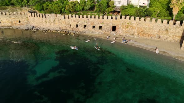 Sup surfing group aerial view 4 K Turkey Alanya