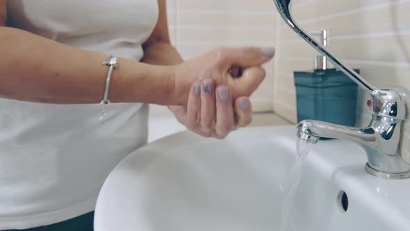 Female Lab Worker Washes Her Hands Before Taking Blood. Woman Washing Her Hands with Soap