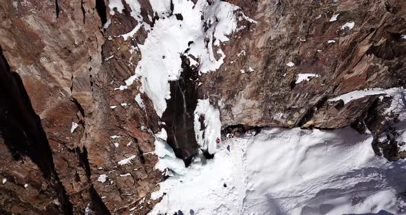 Freezing Waterfall in the Snowy Mountains