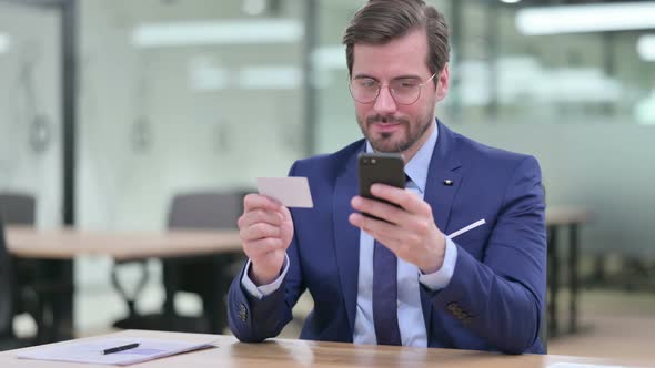Businessman Making Successful Online Payment on Smartphone