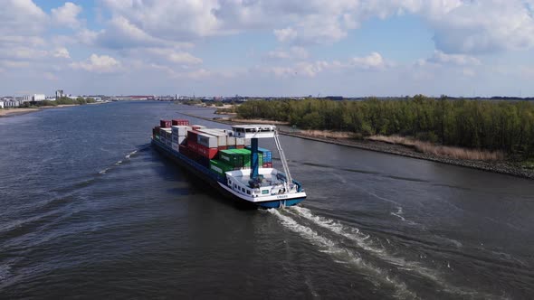 Crigee Freighter Travels In Oude Maas River On A Sunny Day In The Netherlands. aerial