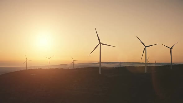 Modern Windmills Wind Turbines Blades Generate Green Energy Electricity in Field