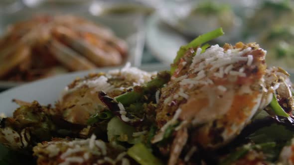 Shrimps and crabs are served on a table in an asian seafood restaurant