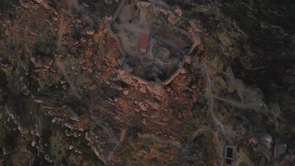 Monsanto castle ruins at sunrise, Portugal.Aerial top-down forward