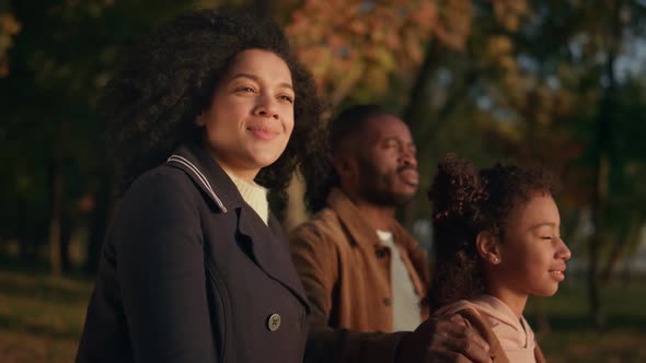 Couple Kid Watching Sunset in Autumn Park Together Portrait