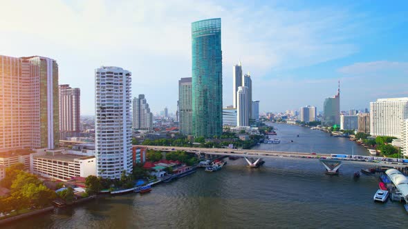 4K : Drones fly over the Chao Phraya River, buildings and business districts in Bangkok