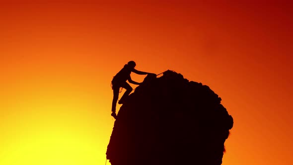 A Mountaineer Climbs The Last Few Meters Before The Summit