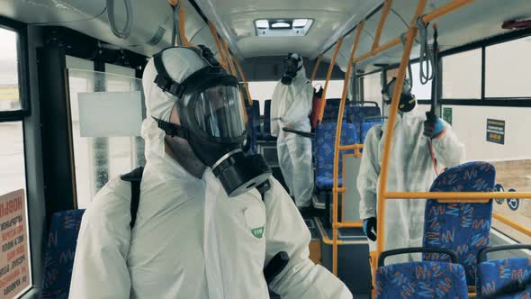 People Spray a Bus with Antiseptics To Kill Coronavirus.