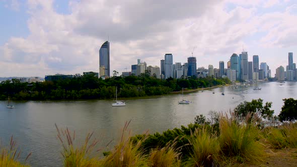 Brisbane River & Cityscape with panning shot back to bridge