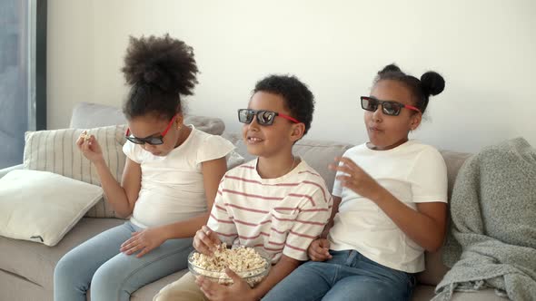 Cute Children in 3d Glasses Watching Movie on Couch