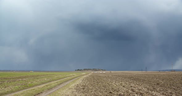 Accumulation Of Snow Clouds Over The Field