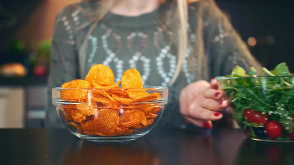 Young Lady Preferring Crisp To Salad