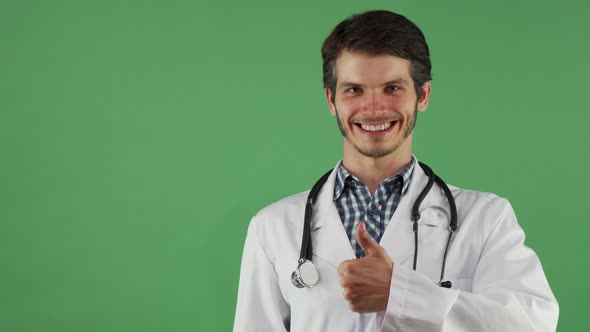 Happy Male Doctor Showing Thumbs Up Smiling Cheerfully