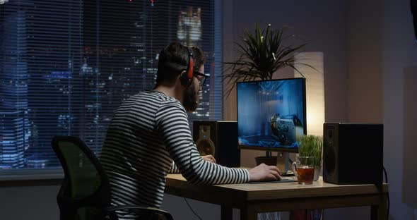 Young Man Playing Video Game Inside a Room