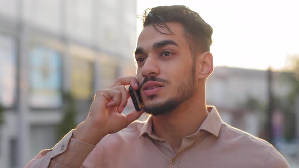 Hispanic Business Man Bearded Guy Standing in City Background of Sunset Talking on Mobile Phone