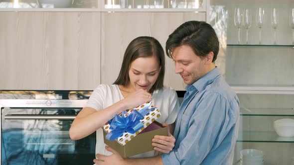 Young Woman Surprised By Unexpected Present