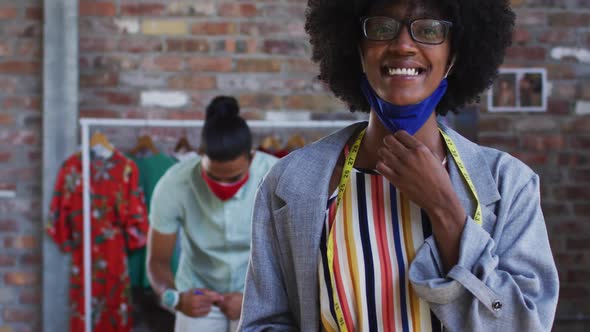 Happy african american female fashion designer looking at camera and smiling