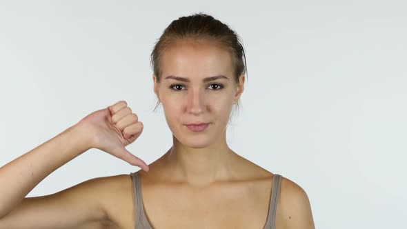 Thumbs Down, Portrait of Successful Beautiful Girl, White Background