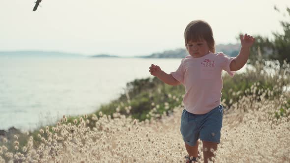 Happy Little Girl Smiling on a Walk in Nature