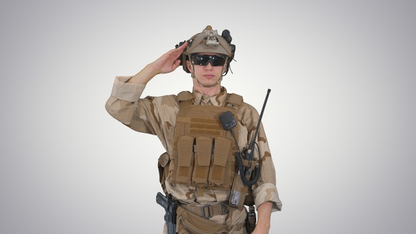 Soldier Ranger in Ammunition Saluting on Gradient Background