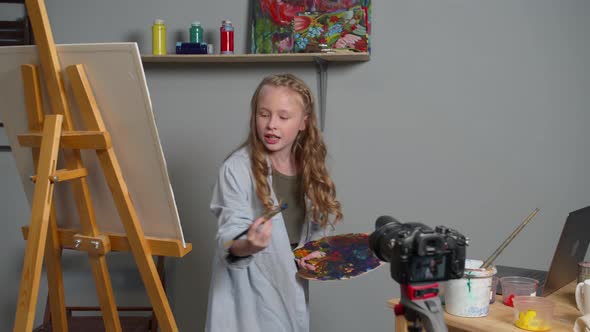 Girl Makes a Video As She Paints a Picture