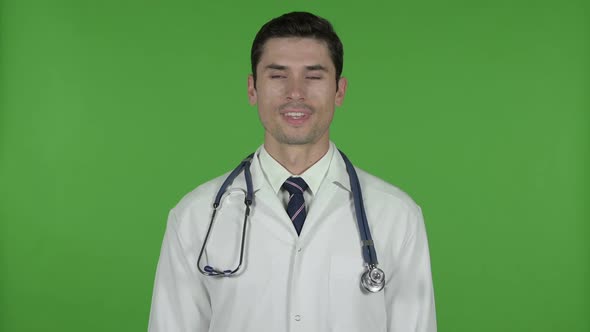 Cheerful Young Doctor Smiling at Camera Chroma Key