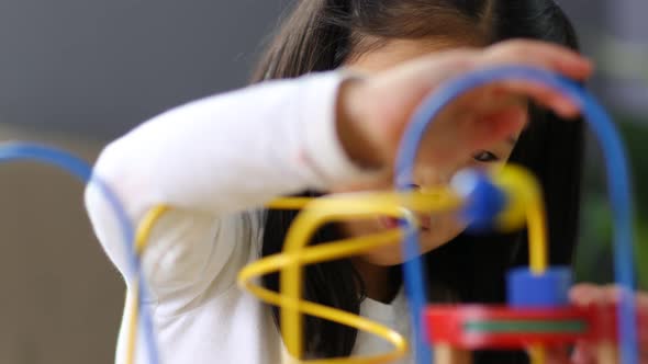 Young Asian girl playing with toys