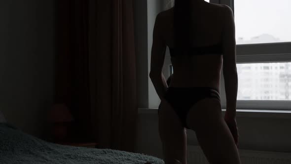 Woman in Black Lingerie Showing Body Shapes