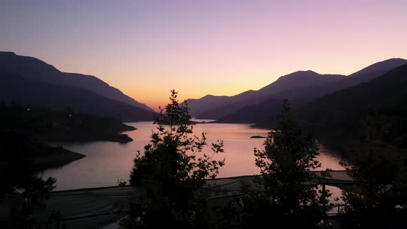 Sunset Over the River in the Mountains Filmed on a Drone