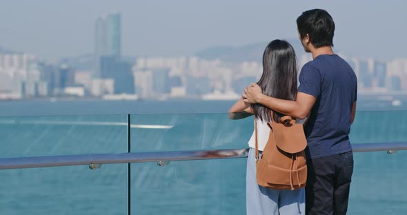 Couple Enjoy Look at The Sea Side in Hong Kong 
