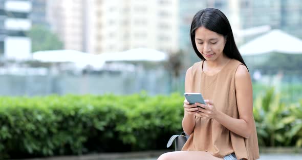 Woman Use of Mobile Phone in The City 