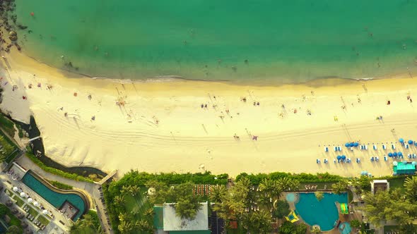 Beautiful water on Kata Noi beach. Drone 4K View of Kata Noi Beach, Phuket, Thailand. Aerial people