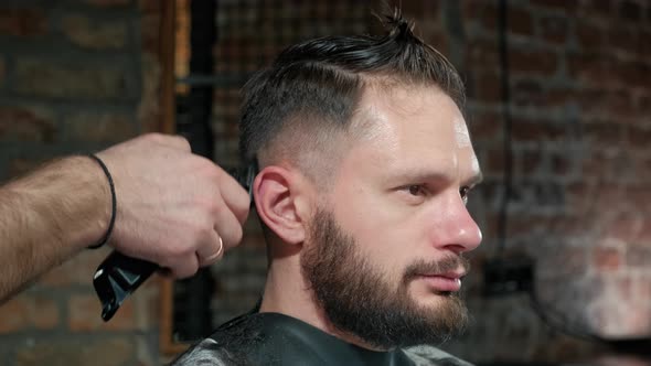 Male Haircut with Electric Razor. Close Up of Hair Trimmer Hairstyle. Professional Hairdresser